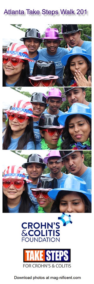 A group poses for a photo with fun hats at a charity event